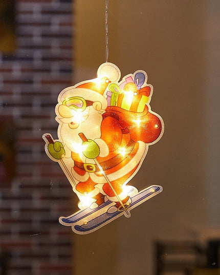 Decoratiune de Craciun pentru fereastra Mos Craciun pe schiuri, cu LED-uri