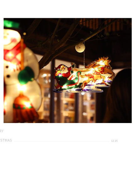 Decoratiune de Craciun pentru fereastra Sanie cu reni, cu LED-uri