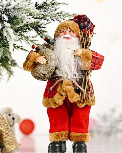Figurina Decorativa Craciun, Mos Craciun Asezat cu Surcele la Brat,Material Plastic+Textil, Interior/Exterior