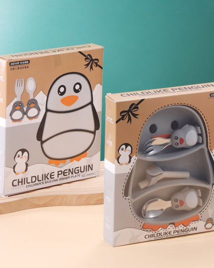 Set diversificare bebelusi din silicon, 23.5 x 12.5 cm, 1 farfurie compartimentata in forma de pinguin, lingurita si furculita, pai, perie pai, fara alergeni, ventuza fixare, forma creativa