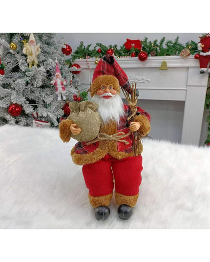 Figurina Decorativa Craciun, Mos Craciun Asezat cu Surcele la Brat,Material Plastic+Textil, Interior/Exterior